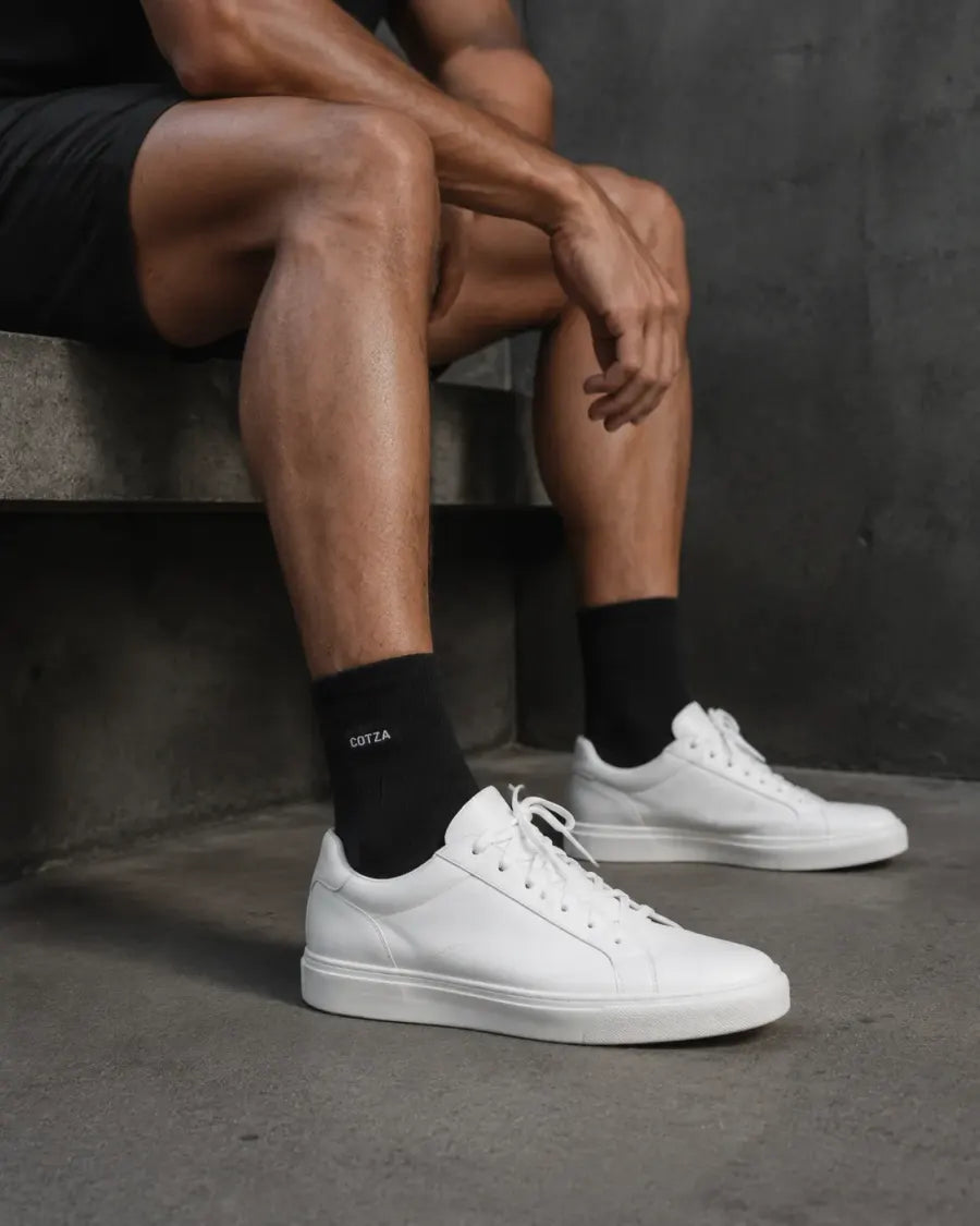 Black COTZA half socks with white sneakers